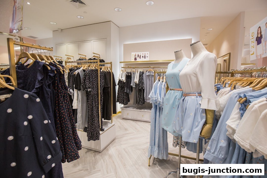 Interior view of a clothing store with racks of dresses and mannequins displaying outfits.