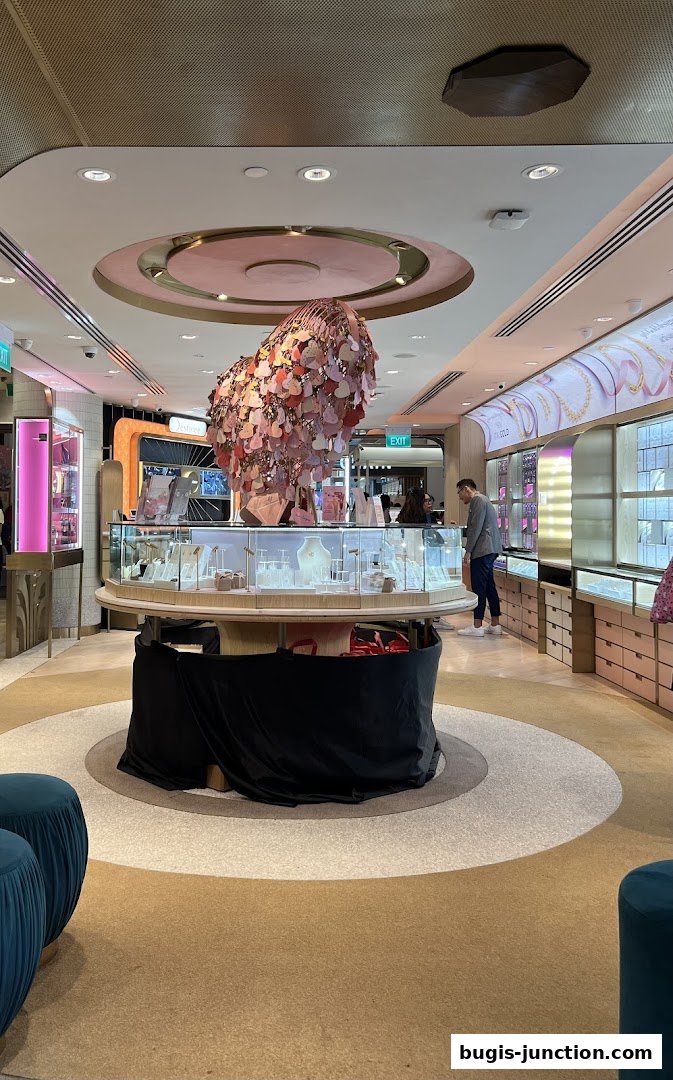 Interior of a jewelry store with display cases and a decorative centerpiece.