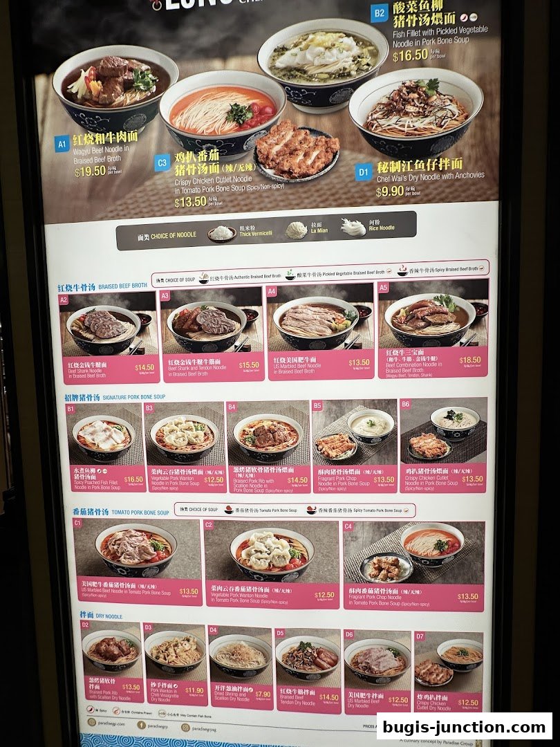 A menu board displaying various noodle dishes with prices and descriptions at LeNu Chef Wais Noodle Bar.