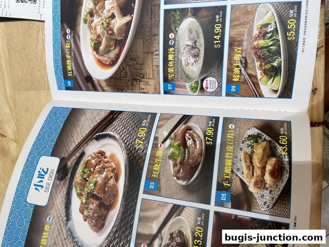 A menu from LeNu Chef Wais Noodle Bar featuring various noodle dishes and side dishes.