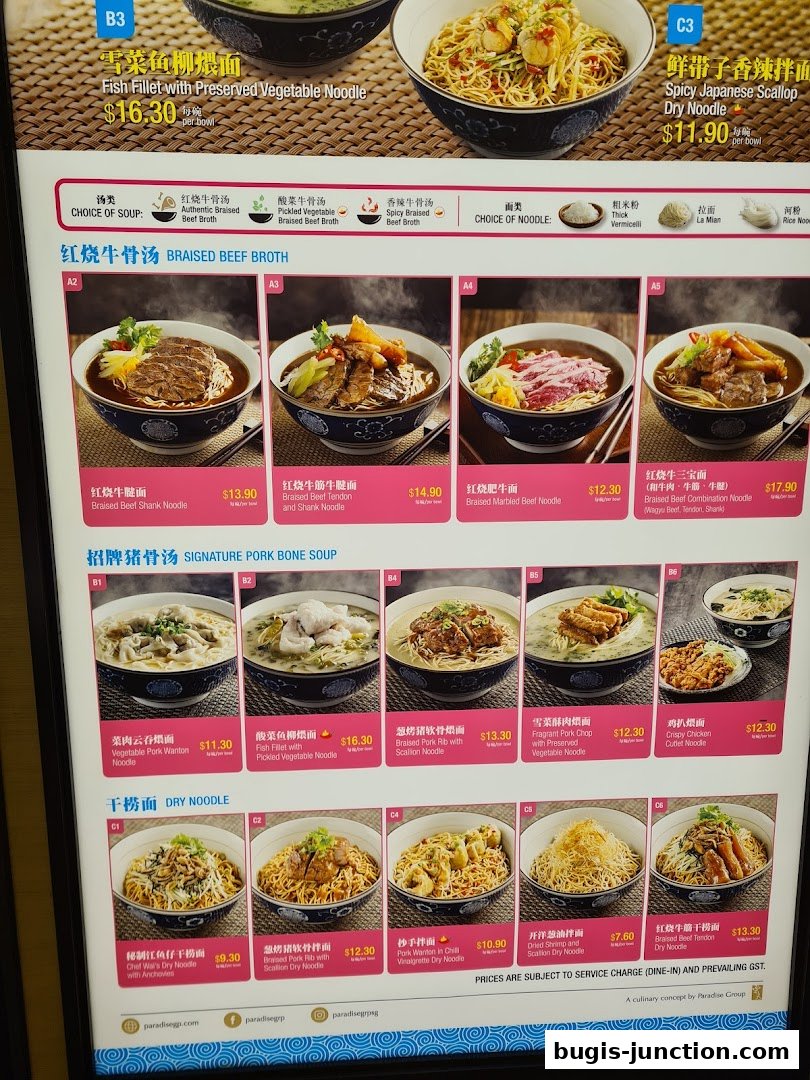 A menu board displaying various noodle dishes with prices and appetizing images.