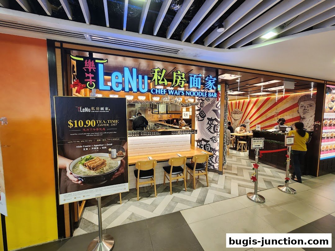 The exterior of LeNu Chef Wai's Noodle Bar with a promotional sign.