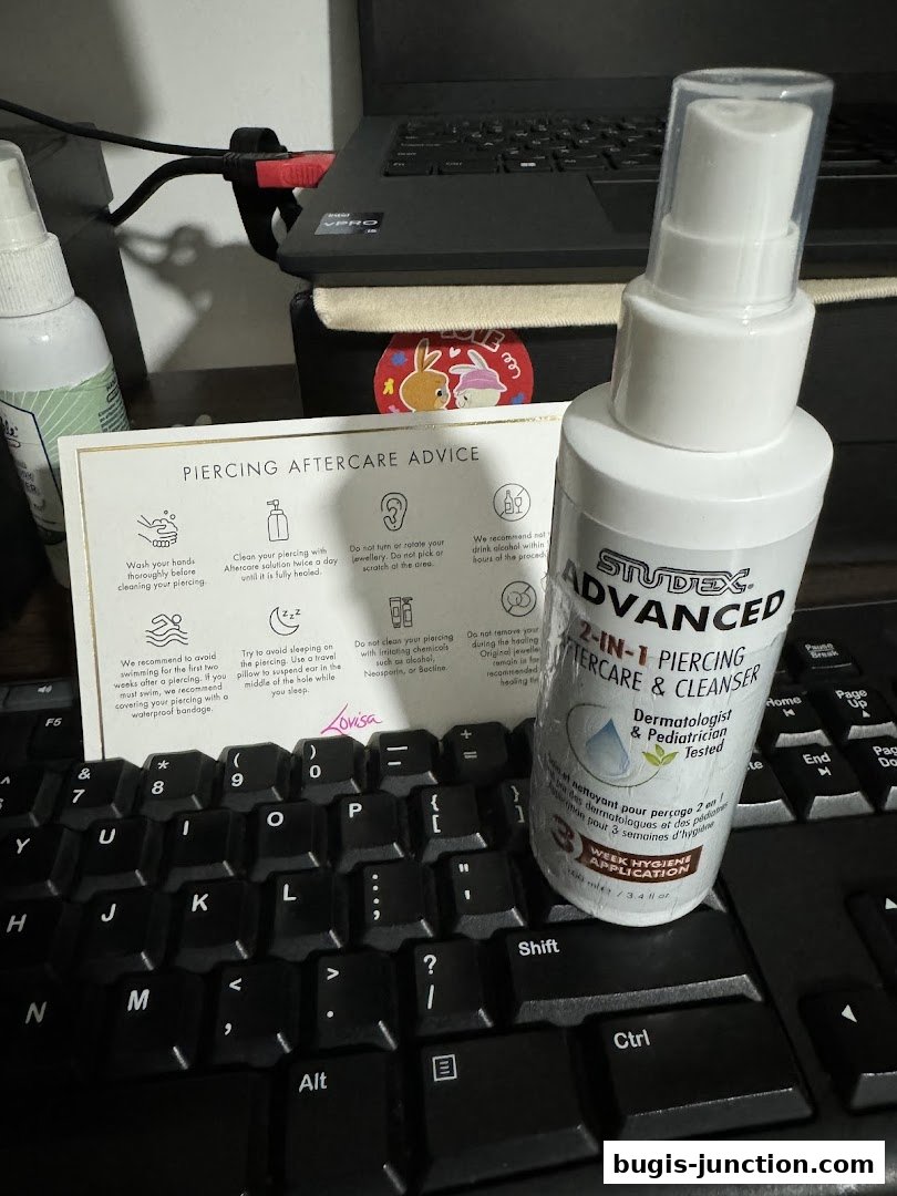 A bottle of Studex Advanced 2-in-1 Piercing Aftercare & Cleanser with piercing aftercare advice.