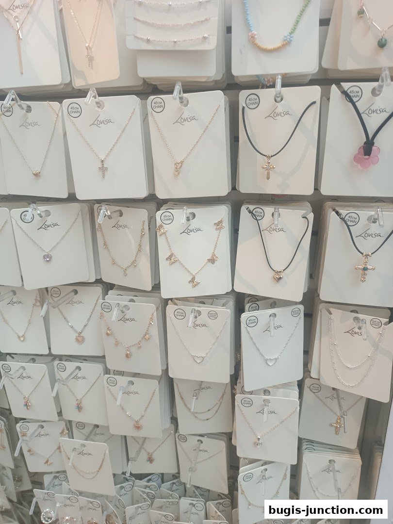 A display wall showcasing a variety of necklaces from Lovisa, featuring delicate chains and pendants.
