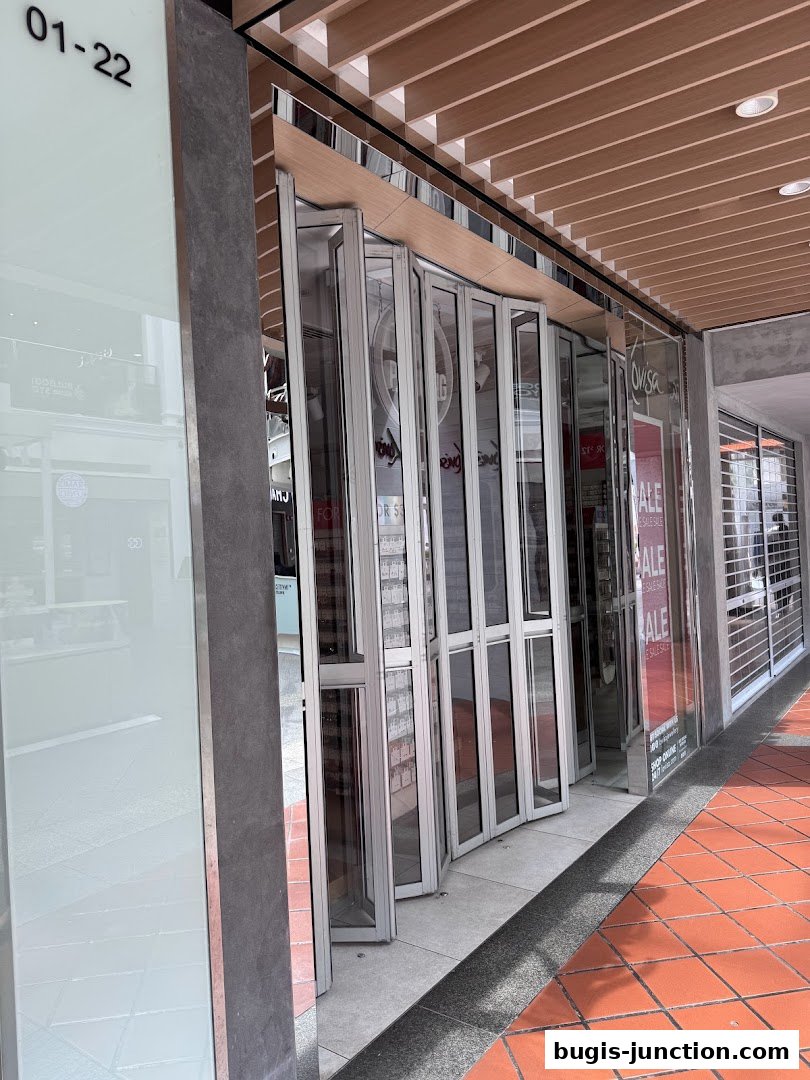 The exterior of a Lovisa store with folding glass doors and sale signs visible.