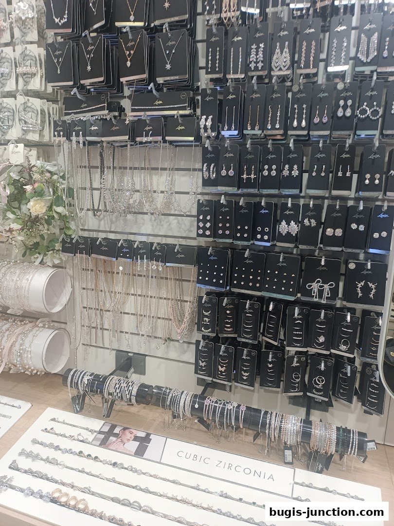 A display of various necklaces, earrings, and bracelets, with a focus on cubic zirconia jewelry.