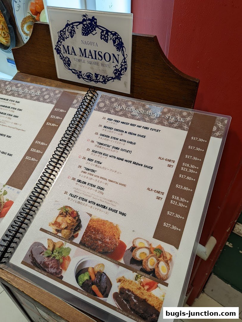 A menu from MA MAISON restaurant featuring main course meat dishes like steak and cutlets.