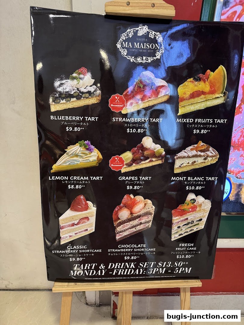 A menu board displaying various tarts and cakes with their prices and descriptions.