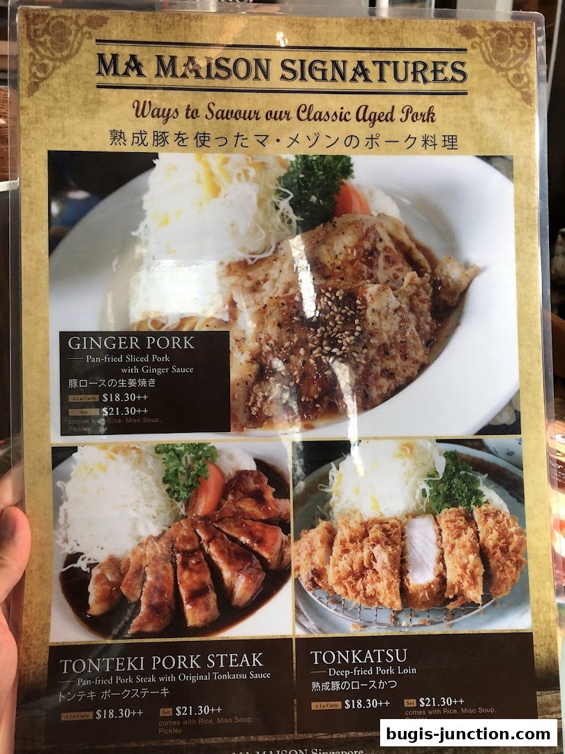 A menu showcasing three classic aged pork dishes from MA MAISON.