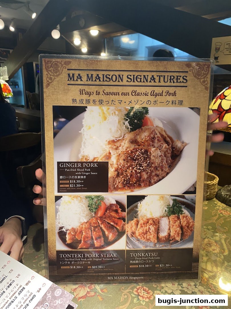 A menu from Ma Maison featuring signature aged pork dishes like Ginger Pork, Tonteki Pork Steak, and Tonkatsu.
