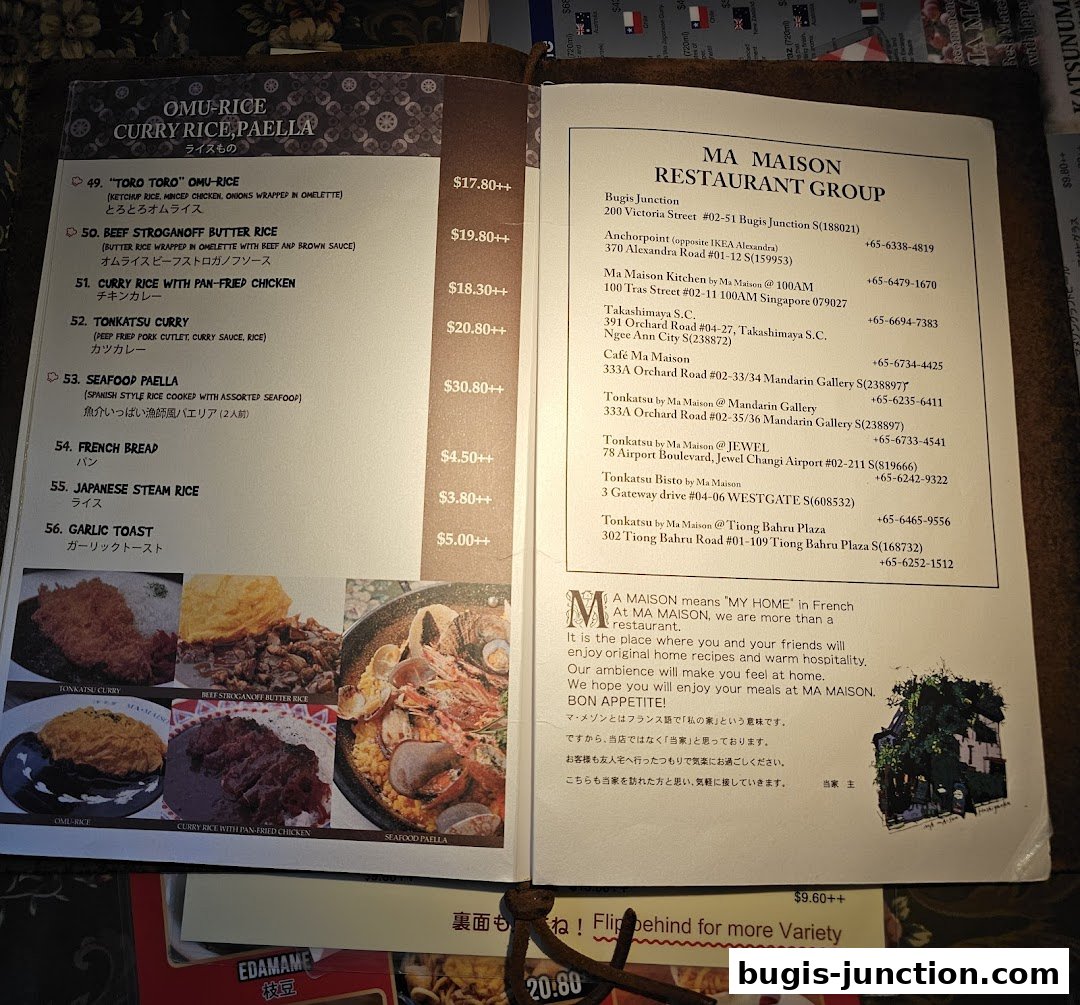A menu from MA MAISON restaurant group featuring Omu-rice, curry rice, and paella dishes.