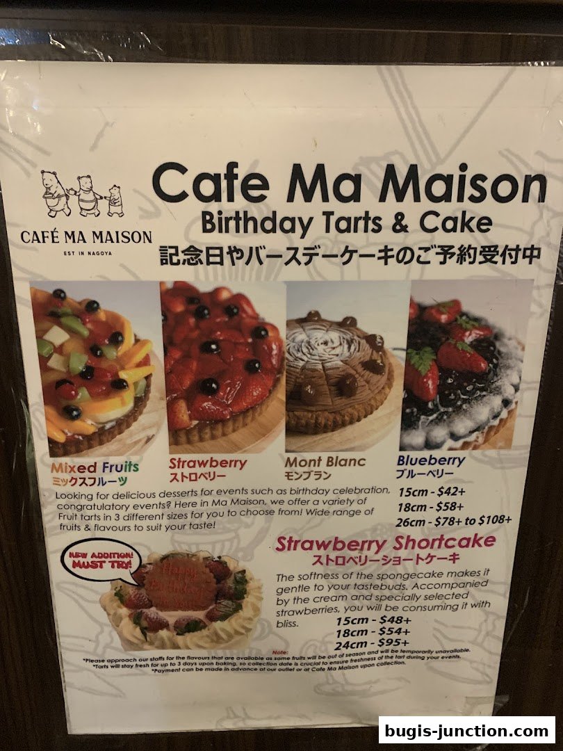 A menu showcasing birthday tarts and cakes from Cafe Ma Maison, featuring various fruit and cake options.