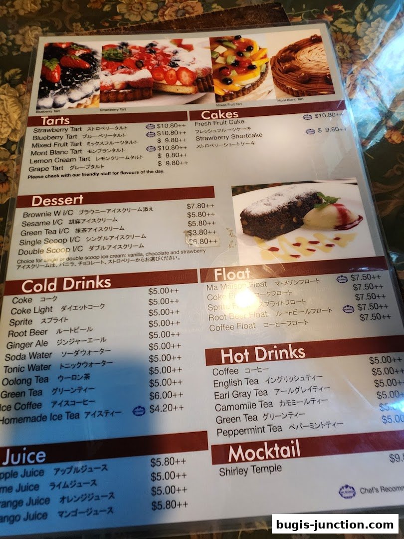 A menu from MA MAISON featuring tarts, cakes, desserts, cold drinks, floats, hot drinks, and juices.