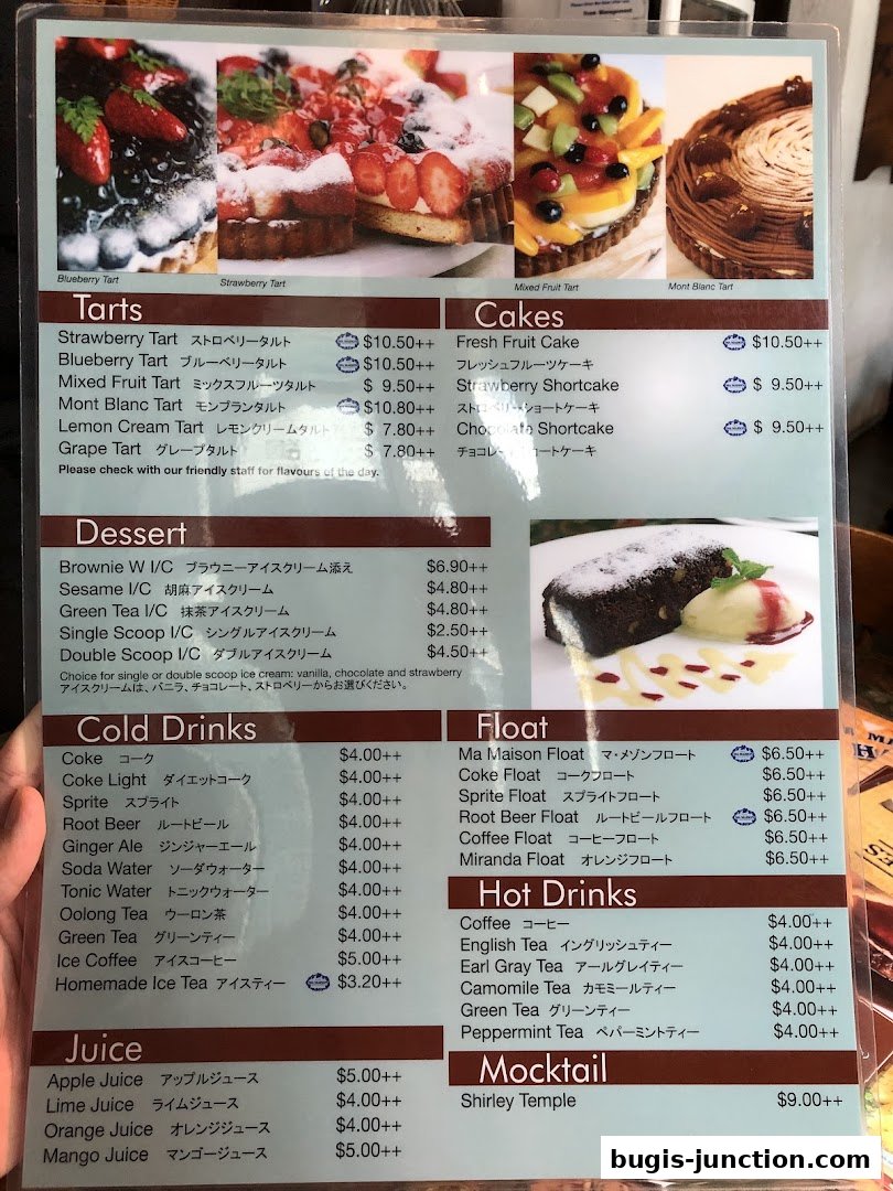 A menu from MA MAISON featuring tarts, cakes, desserts, drinks, and mocktails with prices.