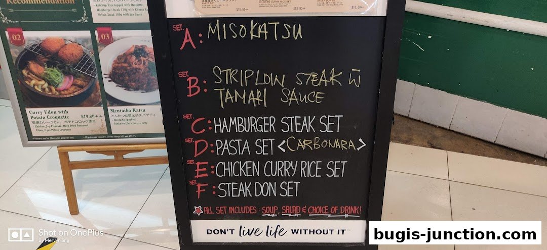 A chalkboard menu displays various set meals with handwritten names and descriptions.