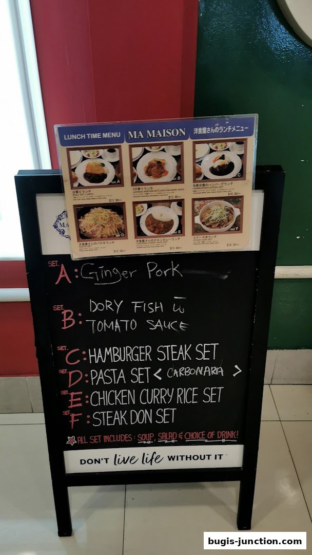 A chalkboard menu for MA MAISON restaurant, showcasing lunch sets with various dishes and prices.