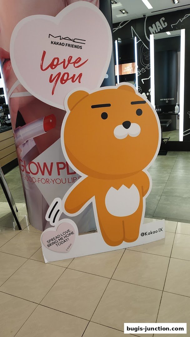 MAC Cosmetics store featuring a large cutout of the Kakao Friends character Ryan.