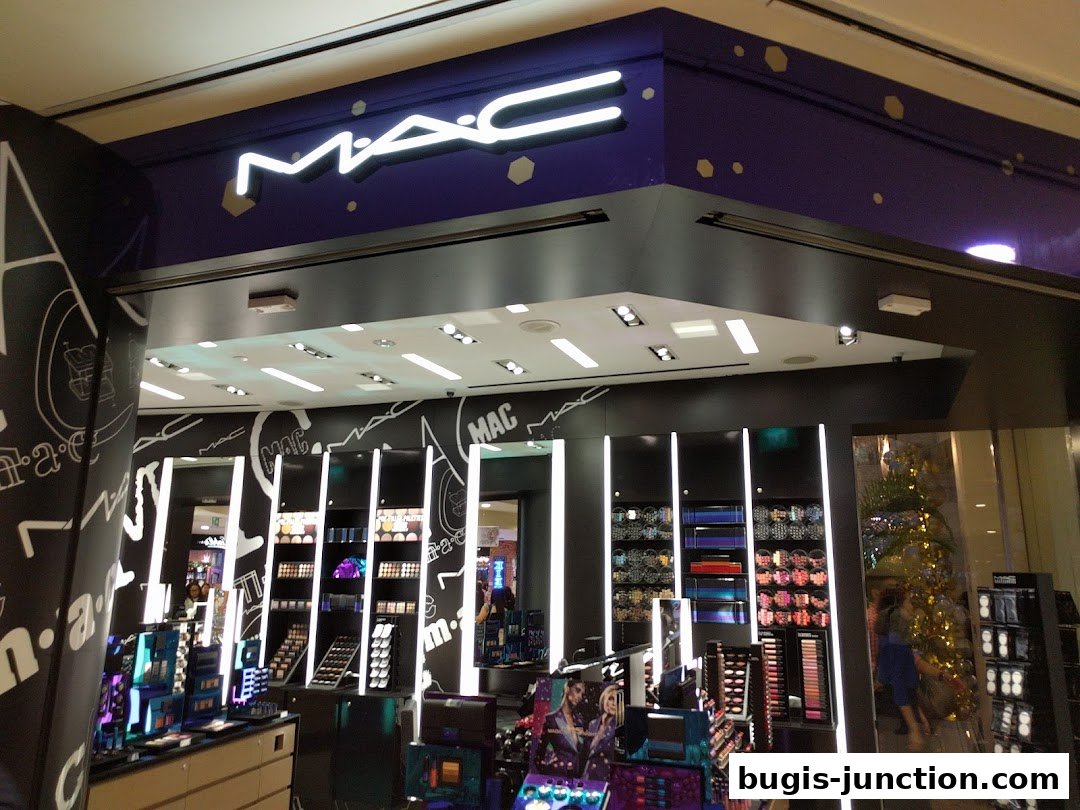 Interior view of a MAC Cosmetics store showcasing makeup products and displays.