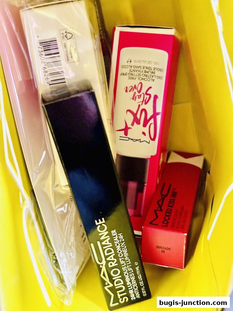 A yellow shopping bag filled with MAC Cosmetics makeup products.