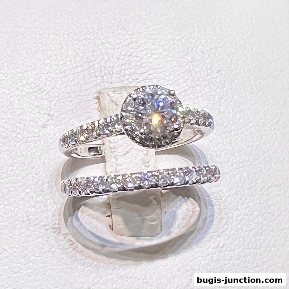 A close-up shot of two diamond rings, one engagement ring and one wedding band.