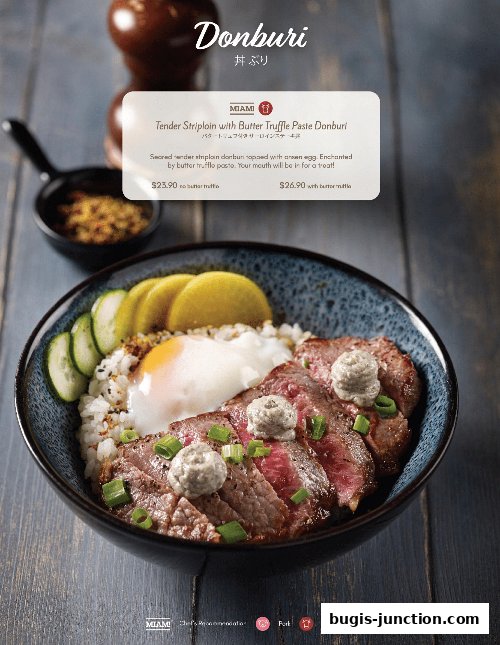 A close-up of a Donburi dish with tender striploin, egg, and truffle paste.