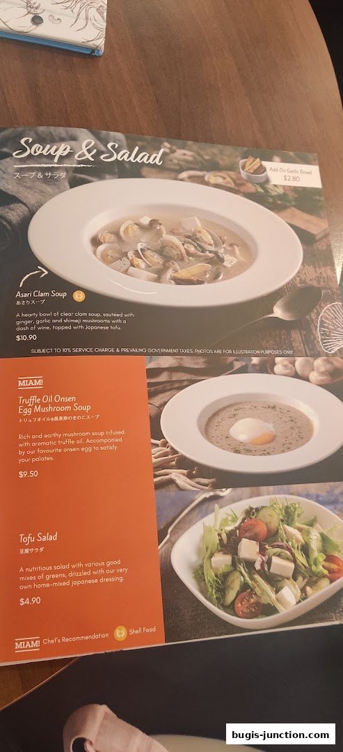 A menu featuring soups and salads, including clam soup, mushroom soup, and tofu salad.