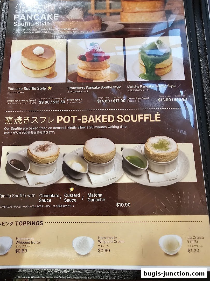 A menu featuring various styles of soufflé pancakes and toppings.