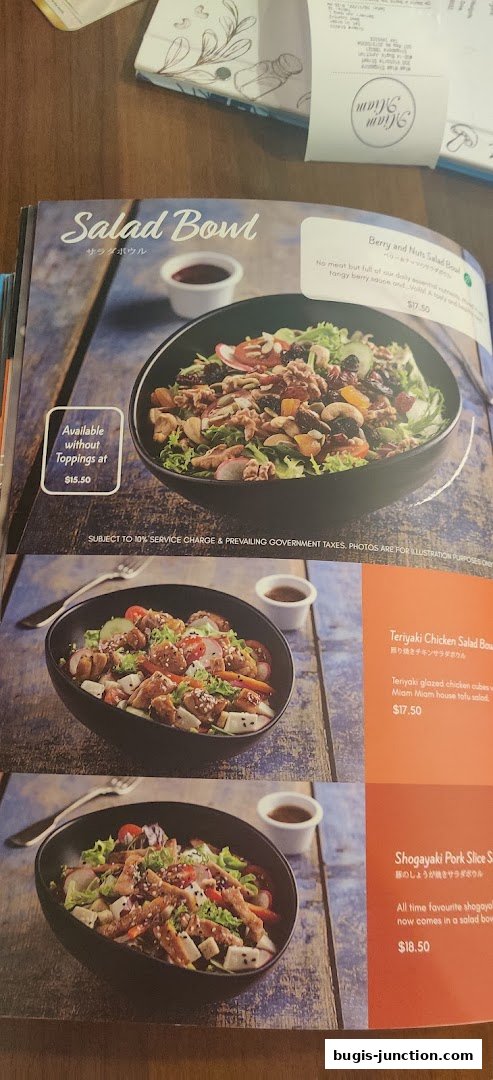 A menu page showcasing various salad bowls with enticing descriptions and prices.