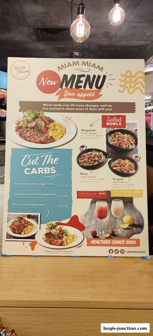 A new menu board for Miam Miam French Japanese Cafe Kitchen featuring salad bowls and carb-free options.