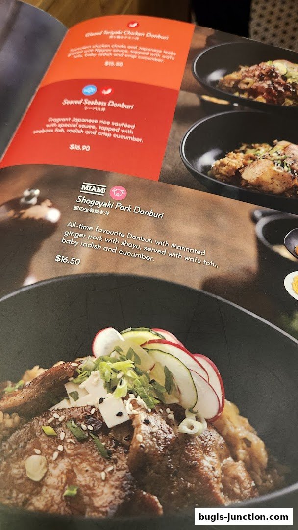 A menu featuring Japanese Donburi dishes with descriptions and prices.
