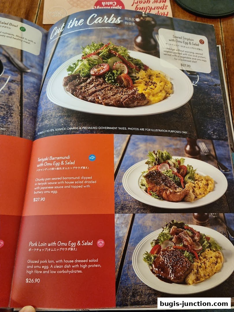 A menu page showcasing three dishes: Seared Striploin, Teriyaki Barramundi, and Pork Loin, all served with Omu Egg & Salad.