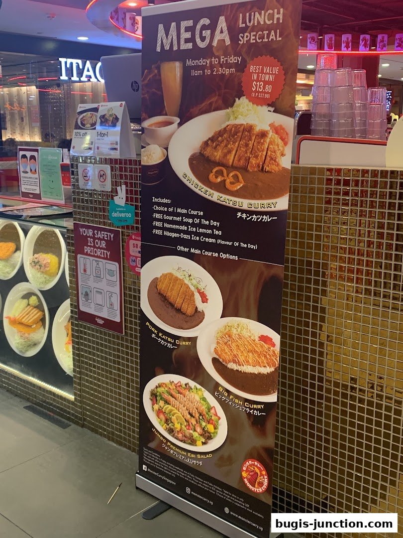 A promotional banner for Monster Curry's Mega Lunch Special featuring various curry dishes and a salad.