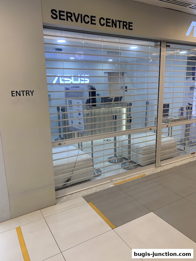 The entrance to an ASUS Service Centre with the roller shutter down.