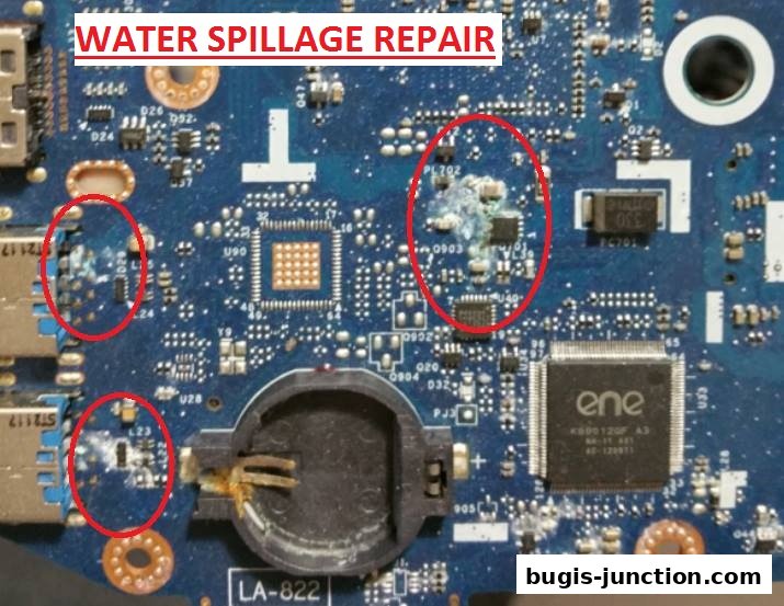 Close-up of a computer motherboard showing water damage and corrosion, with text indicating 'WATER SPILLAGE REPAIR'.