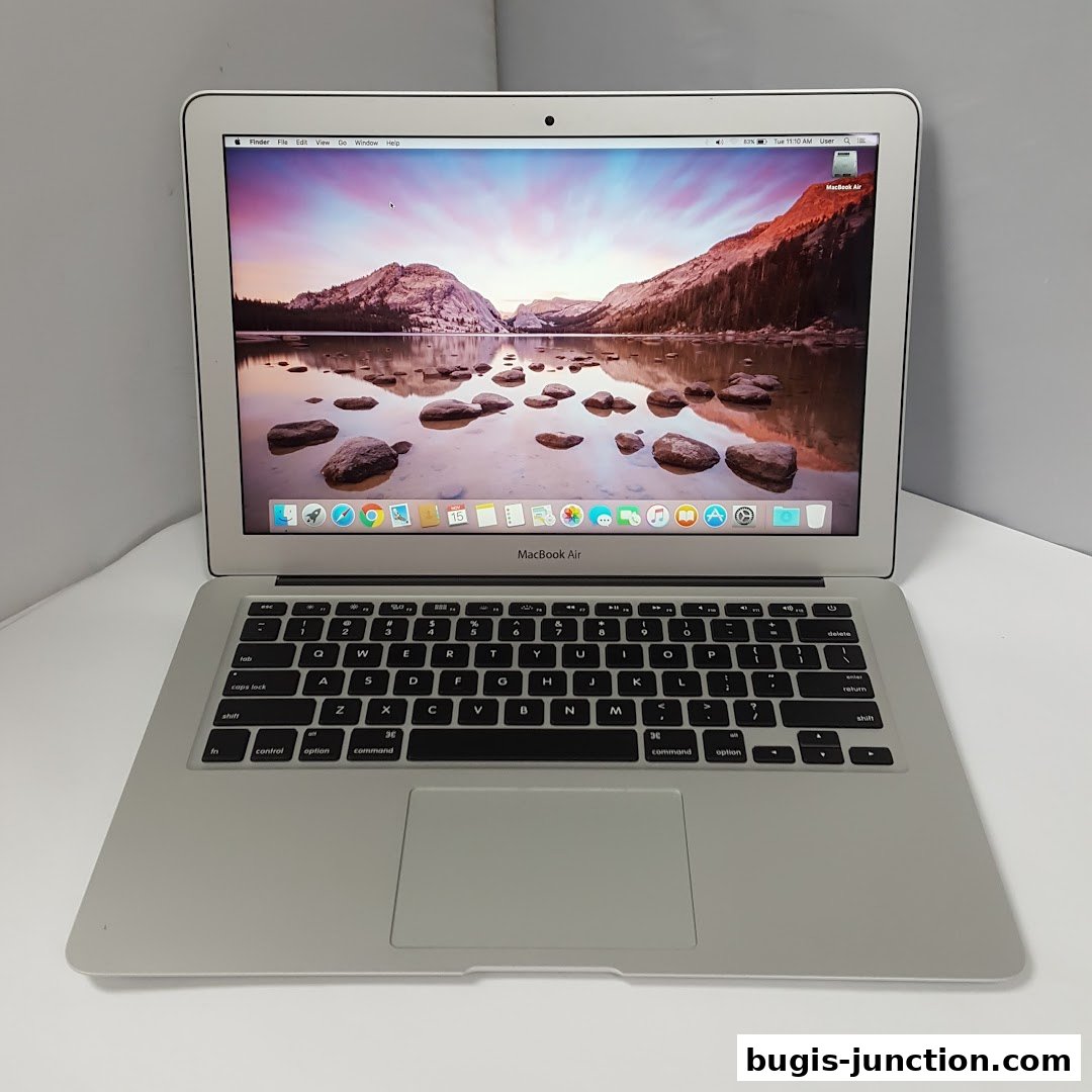 A silver MacBook Air laptop is displayed open on a white surface.
