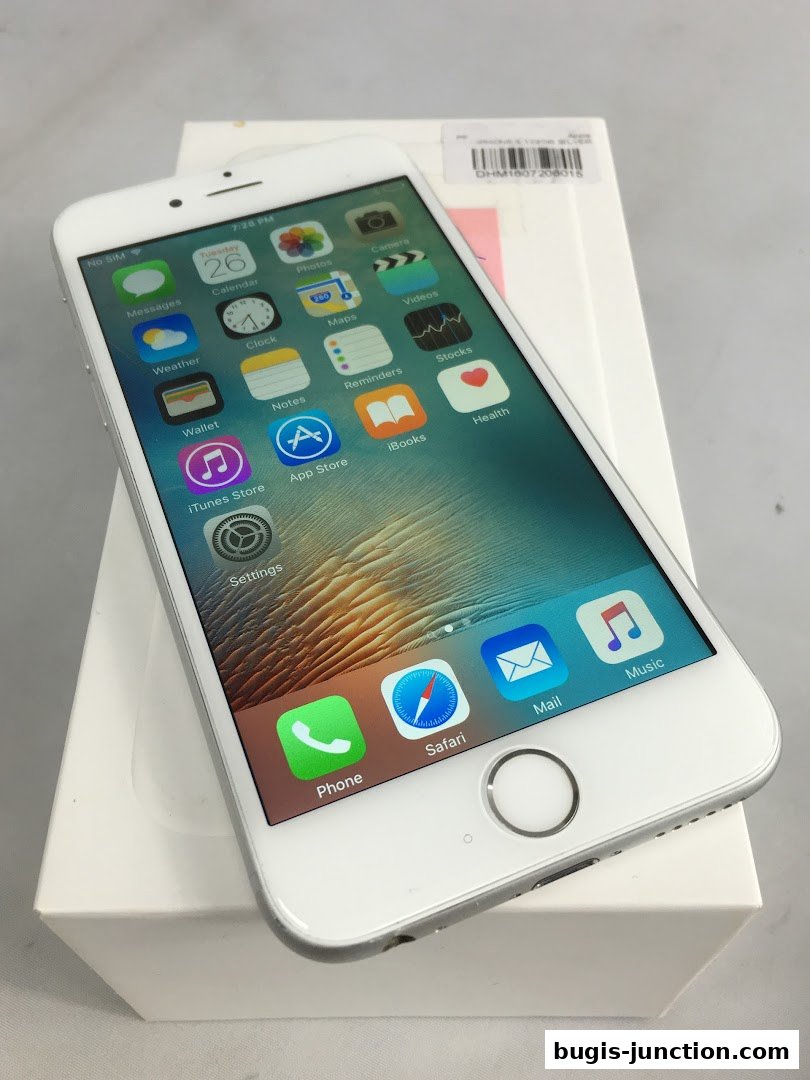 A white iPhone 6s is displayed on its box, showcasing its home screen.