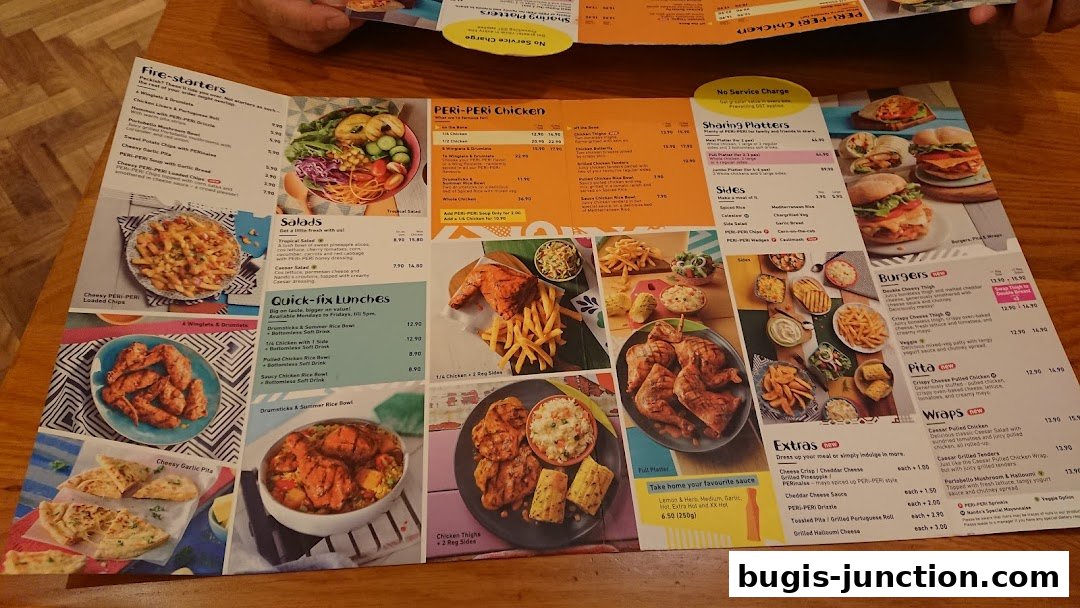 A colorful menu from Nandos featuring flame-grilled PERi-PERi chicken, burgers, salads, and sides.