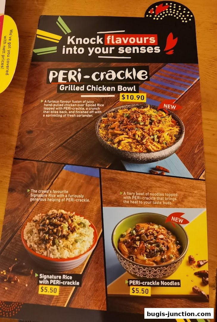 A menu showcasing Nandos PERI-crackle dishes, including a chicken bowl, rice, and noodles.