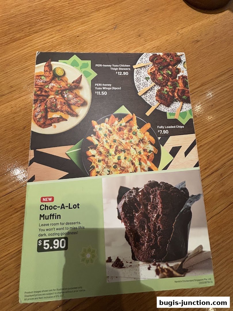 A menu featuring PERi-honey Yuzu Chicken Thigh Skewers, Yuzu Wings, Fully Loaded Chips, and a Choc-A-Lot Muffin.