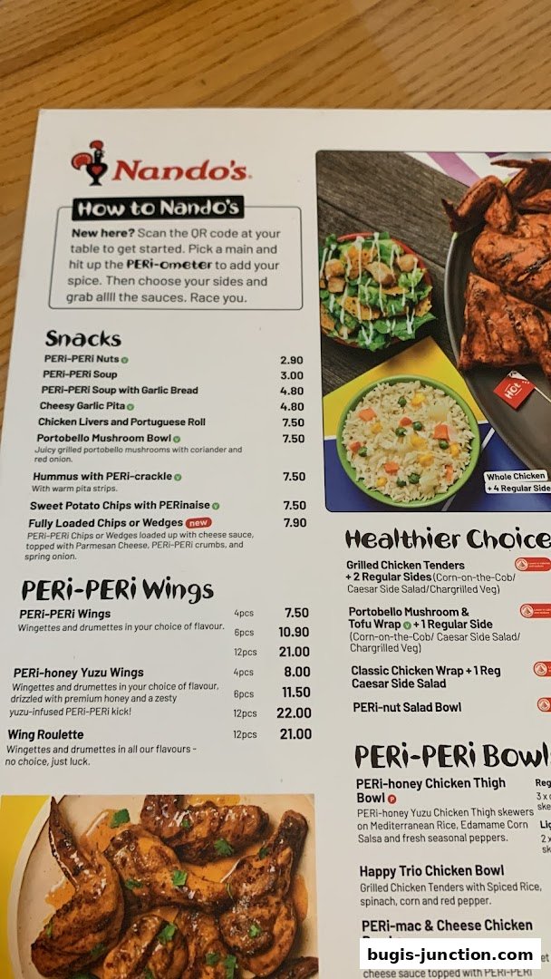 A Nando's menu featuring PERi-PERi chicken, wings, snacks, and bowls with prices.