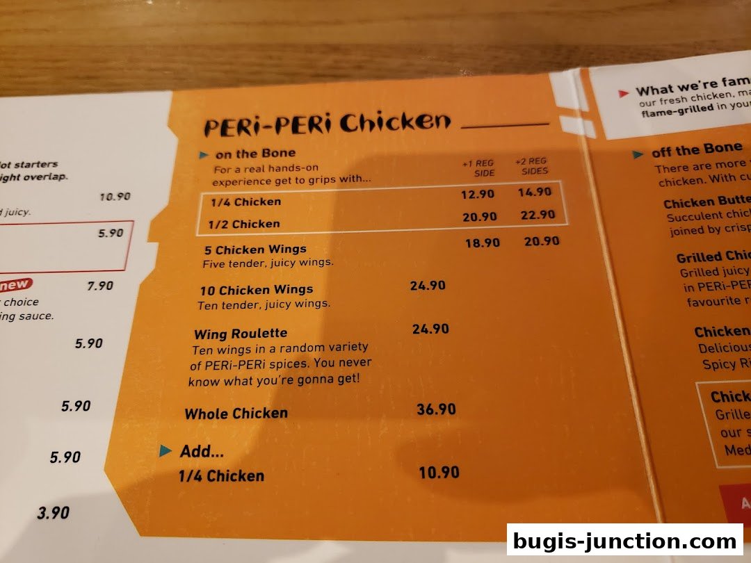 A menu featuring PERi-PERi chicken dishes, including whole chicken and wings, with prices listed.