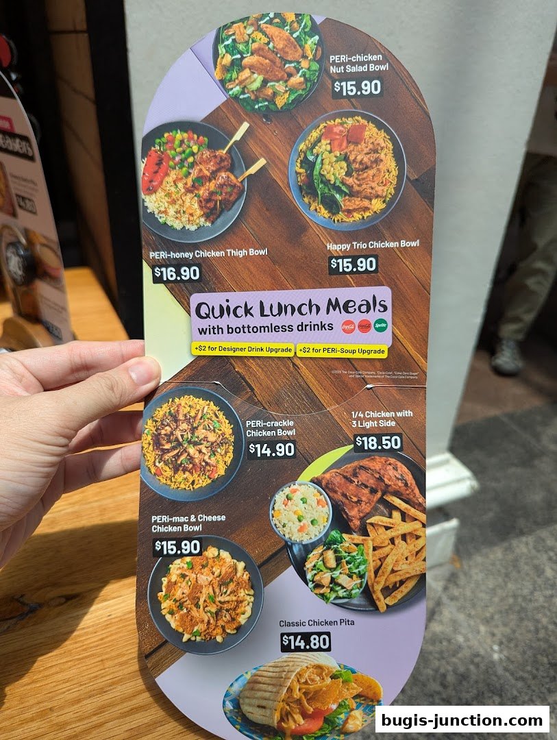 A menu board showcasing various PERi-PERi chicken meals and bowls with prices.