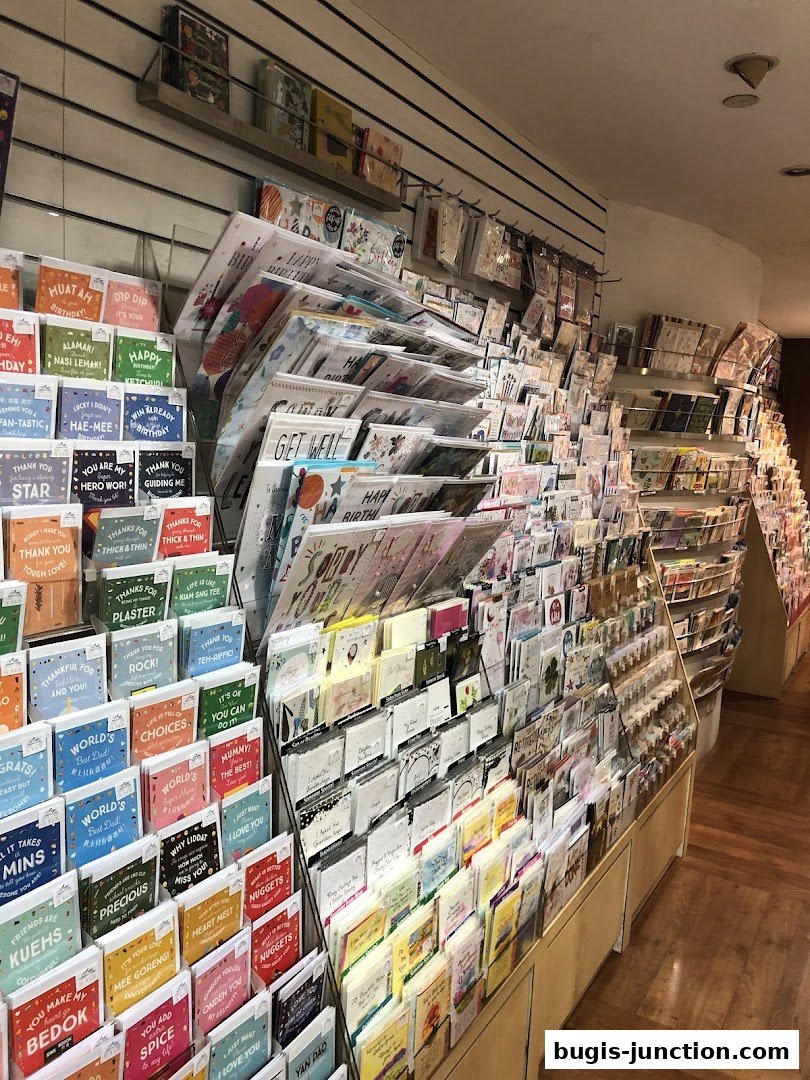 A wide selection of greeting cards displayed on shelves in a retail store.