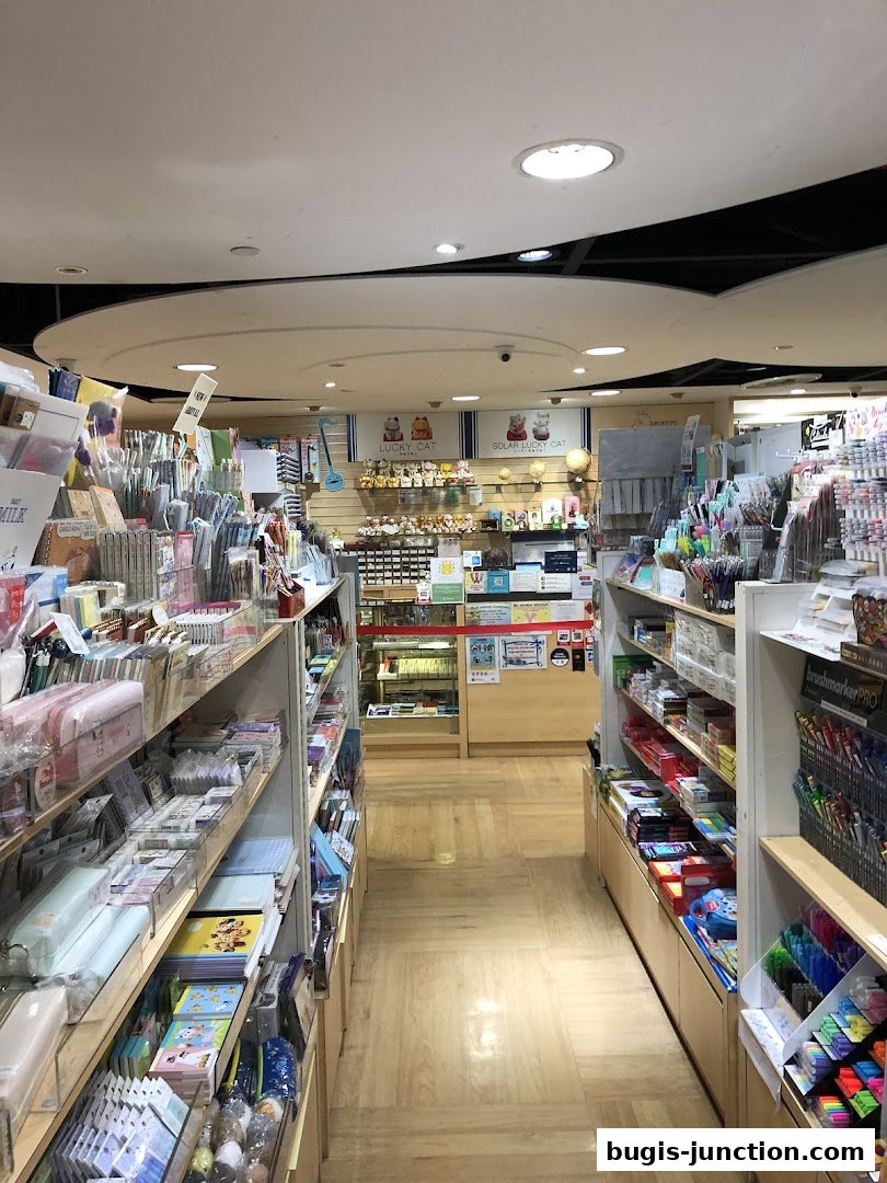 Interior view of a stationery and gift shop with shelves stocked with various items.