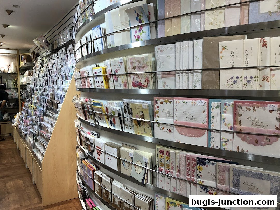 A wide selection of greeting cards and stationery displayed on shelves inside a shop.