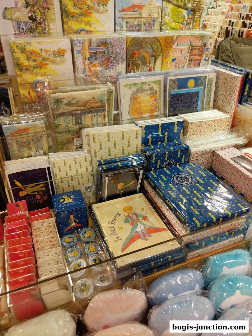 A display of stationery, cards, and plush toys featuring 'The Little Prince' theme.