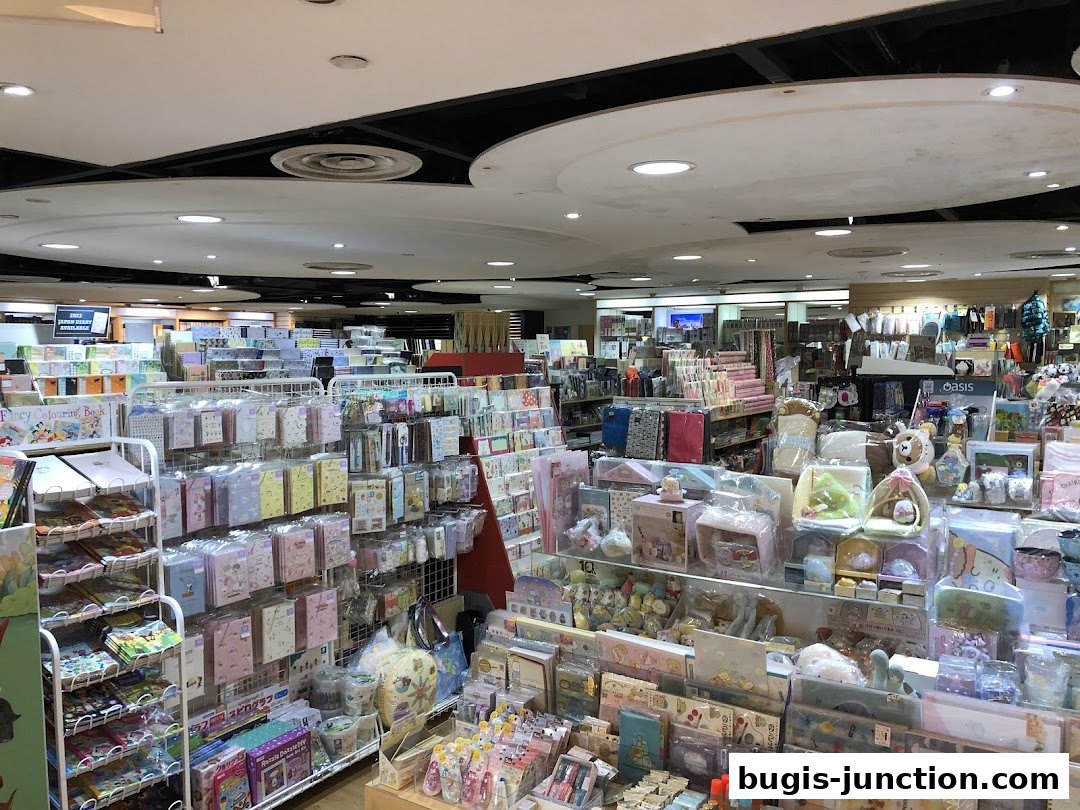 Interior view of a stationery and gift shop with shelves full of colorful products.