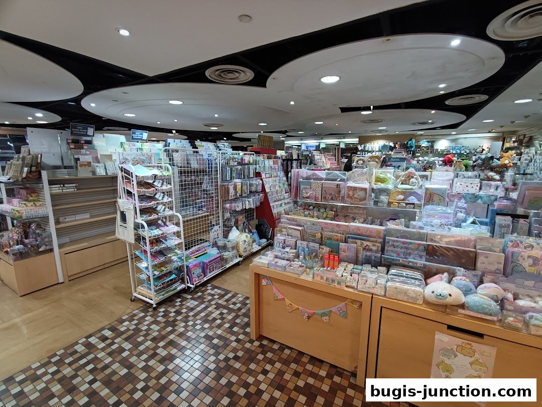 Interior view of a stationery and gift shop with shelves stocked with various items.