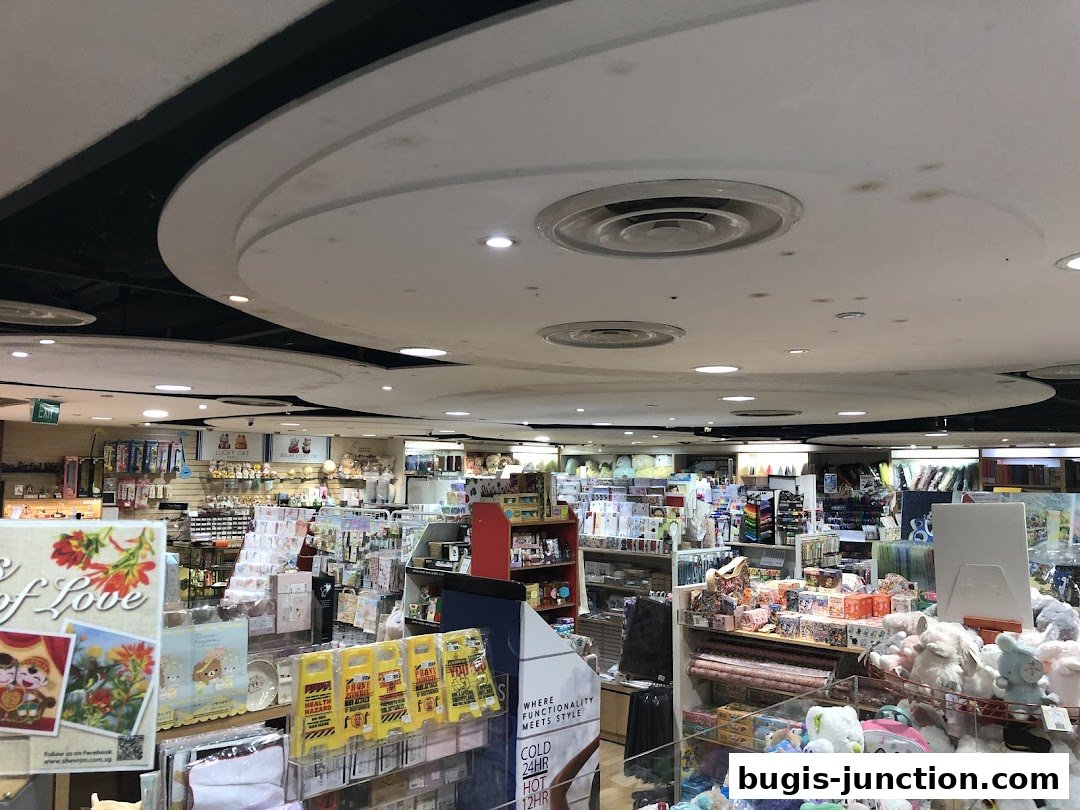 Interior view of a stationery and gift shop with shelves stocked with various items.