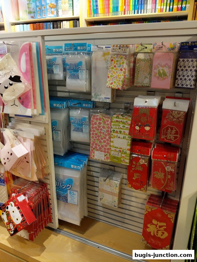 A display of various stationery items including bags, envelopes, and gift packaging.